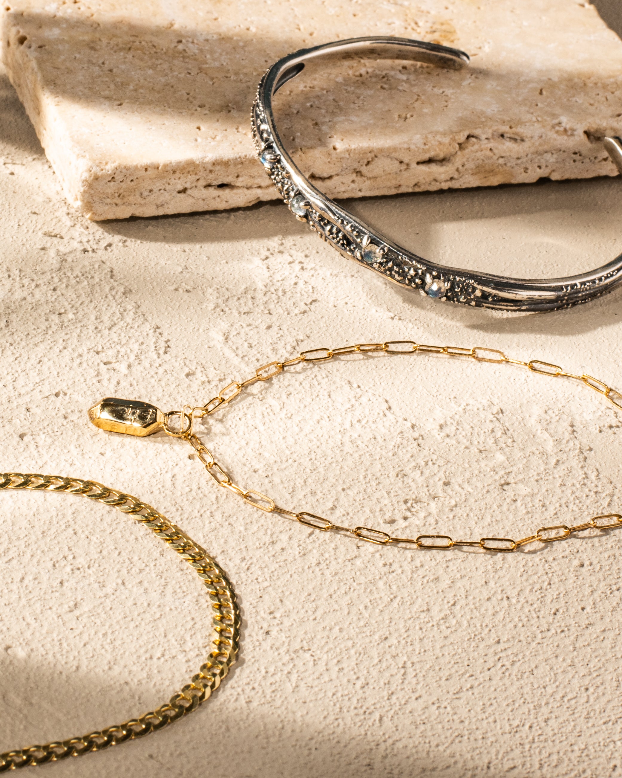 Three custom silver and gold permanent bracelets made with care at Philadelphia's first permanent jewelry store, Angela Monaco Jewelry.