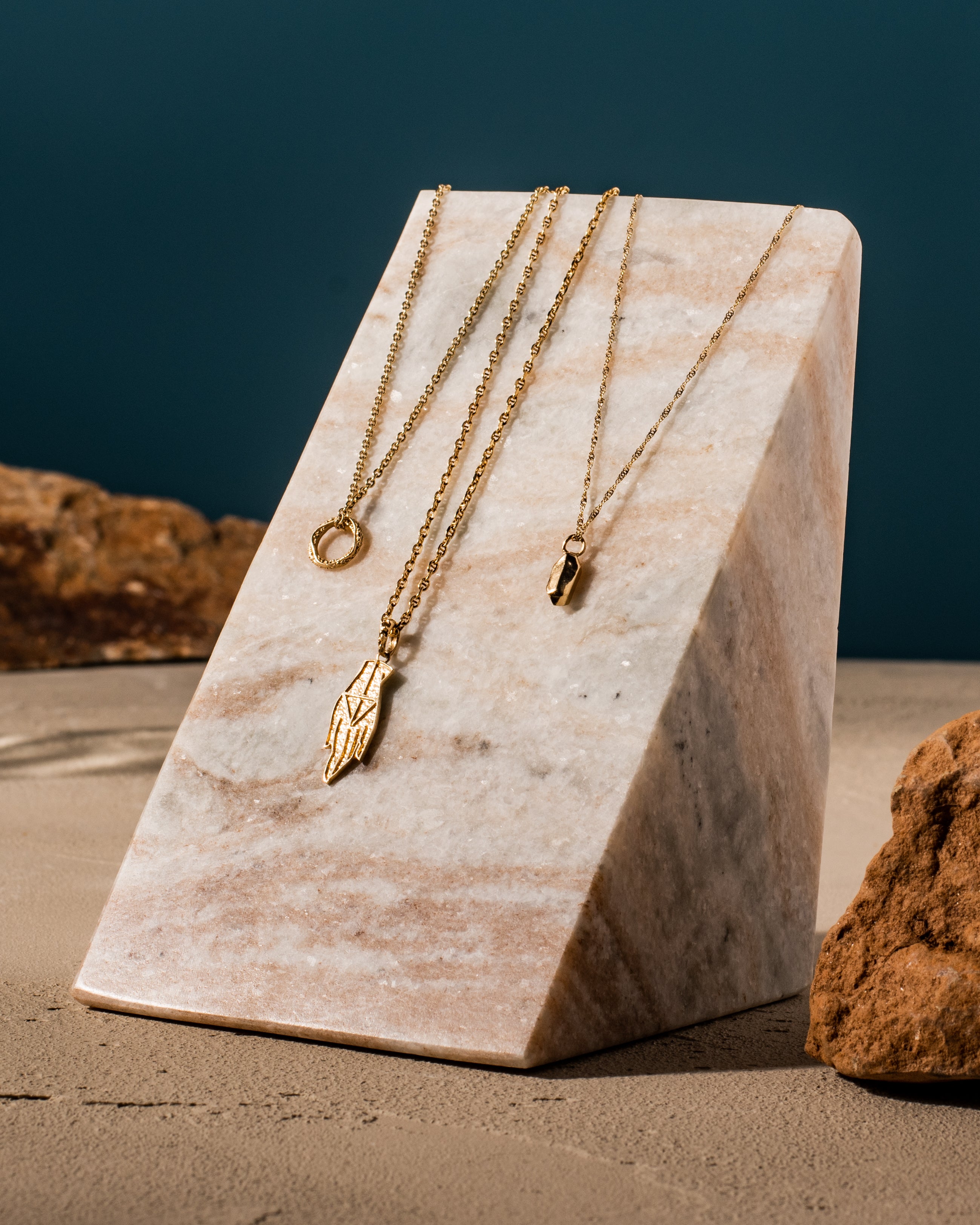 Three custom silver and gold necklaces with handcrafted  pendants that make the perfect gift.