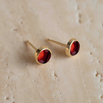 Angela Monaco Jewelry philadelphia 14k yellow gold bezel studs with garnet cabochons