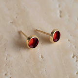 Angela Monaco Jewelry philadelphia 14k yellow gold bezel studs with garnet cabochons