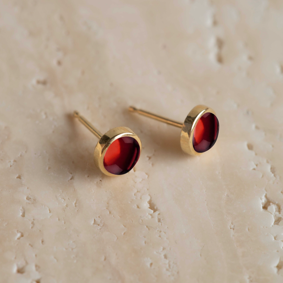 Angela Monaco Jewelry philadelphia 14k yellow gold bezel studs with garnet cabochons
