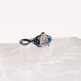 TWISTED SHANK SAPPHIRE THREE STONE ENGAGEMENT RING