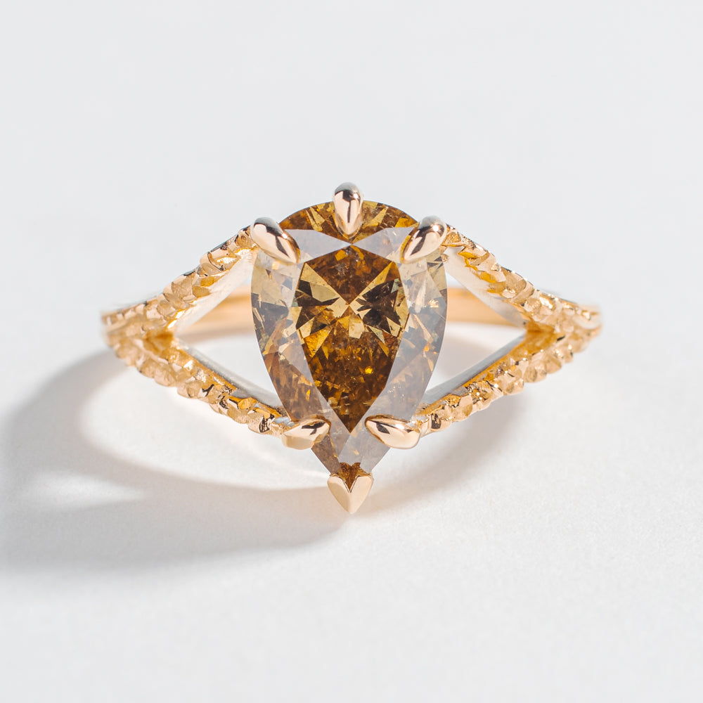one of a kind engagement ring with solid gold medievel looking game of throne engagement ring with pear shape brown salt and pepper diamond by angela monaco jewelry