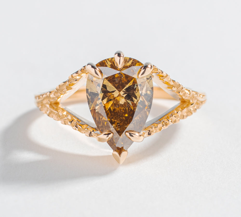 one of a kind engagement ring with solid gold medievel looking game of throne engagement ring with pear shape brown salt and pepper diamond by angela monaco jewelry