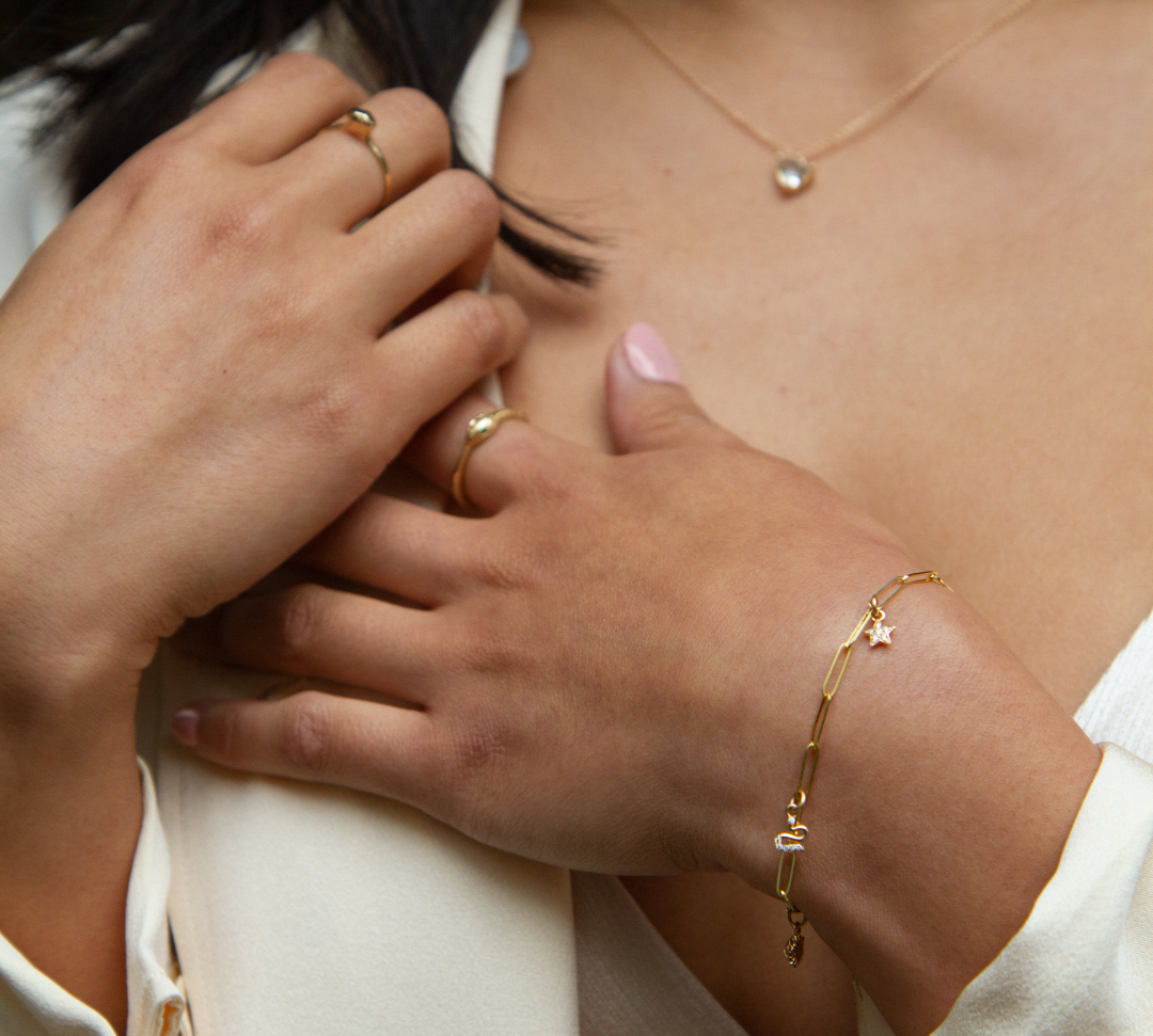 angela monaco jewelry philadelphia jeweler classic paperclip chain bracelet 14K yellow gold charms star sun snake